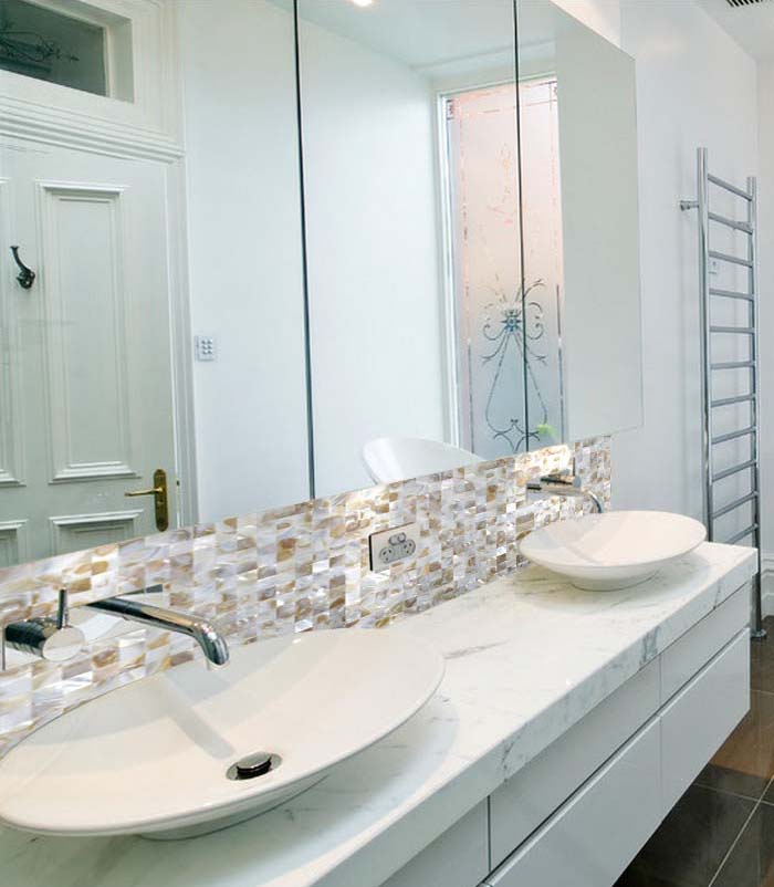 mother of pearl tile bathroom mirrored wall backsplash